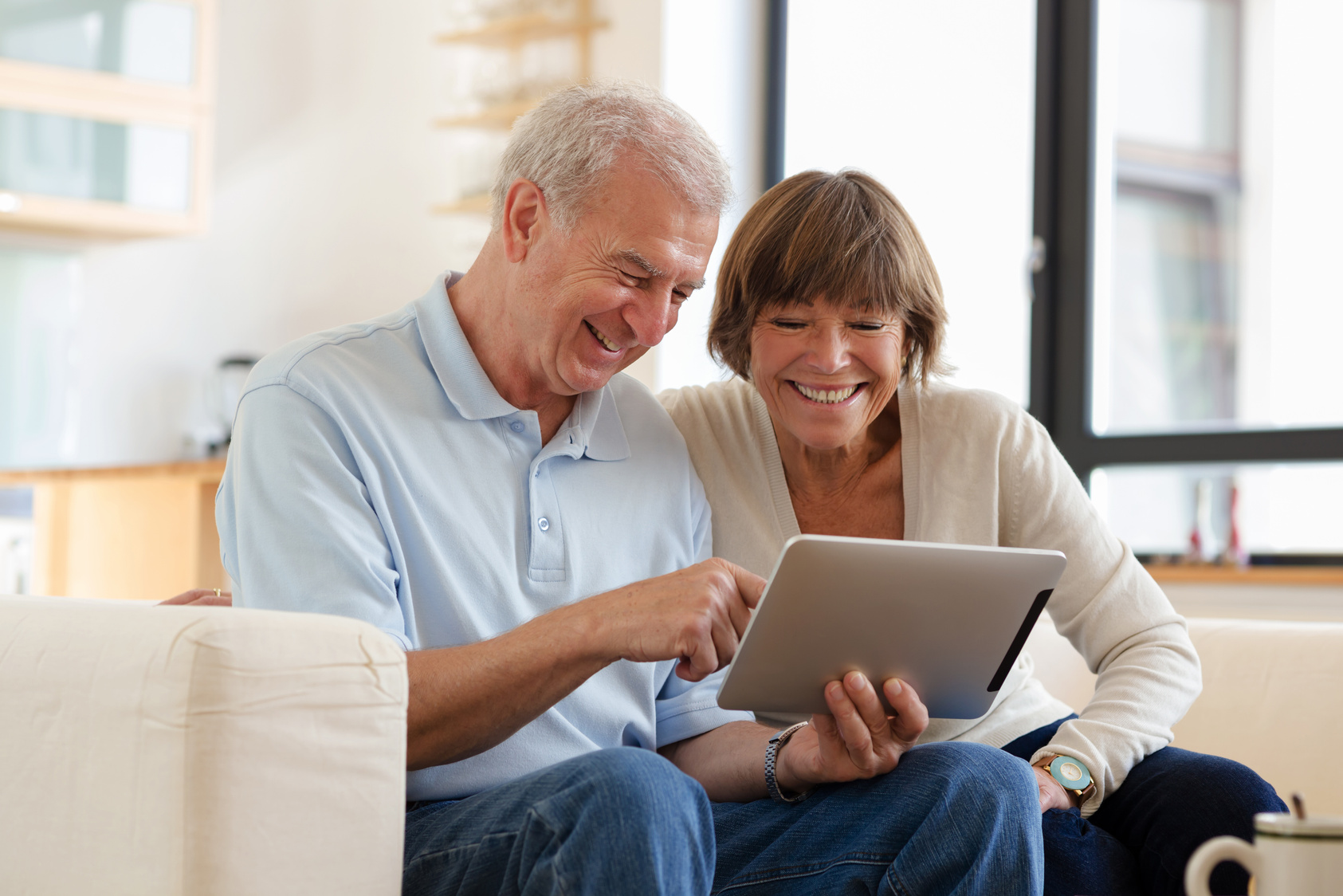 Senior couple with tablet computer