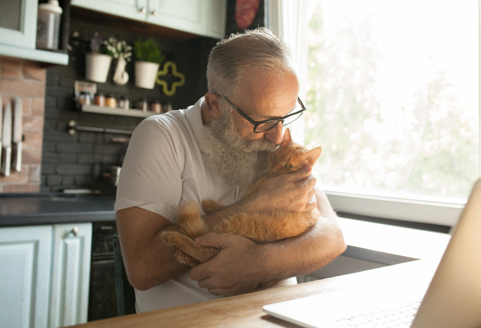 Elderly man with his cat